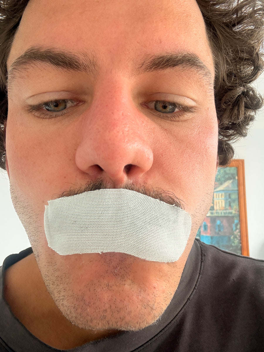 Close-up of Rory wearing mouth tape