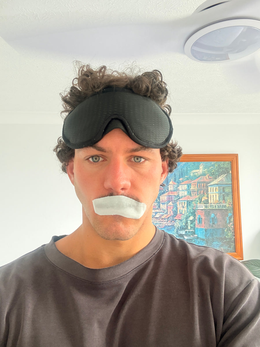 Rory wearing the sleep mask, a nose strip and mouth tape