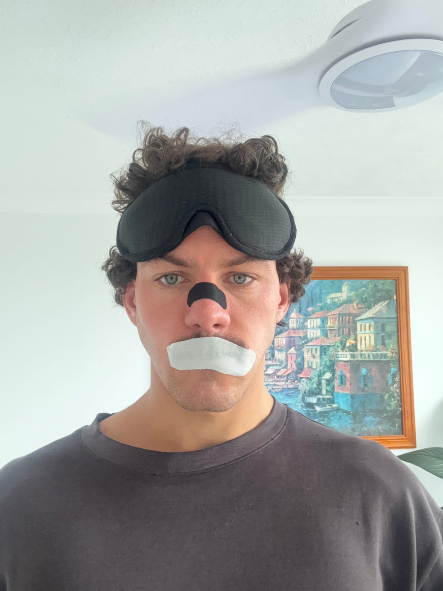 Rory wearing the sleep mask, nose strip and mouth tape